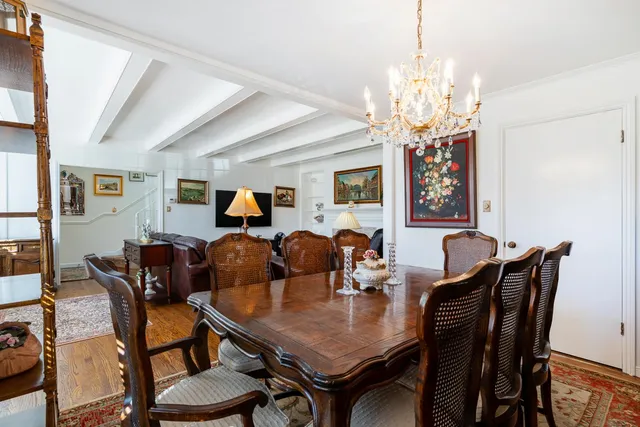 a view of a livingroom with furniture and a window