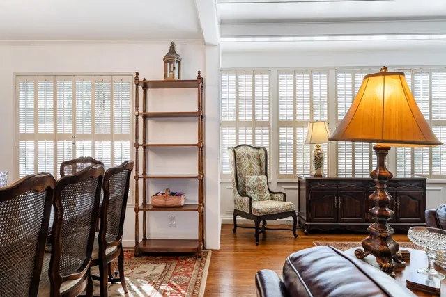 a view of a dining room with furniture and window