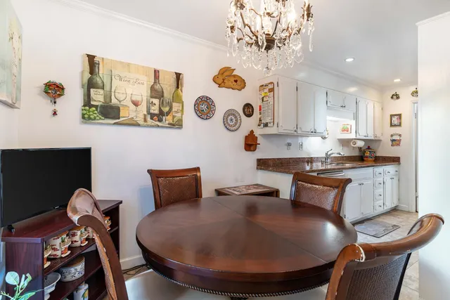 a kitchen with stainless steel appliances granite countertop a refrigerator and a stove