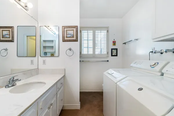 a bedroom with a bed and a table