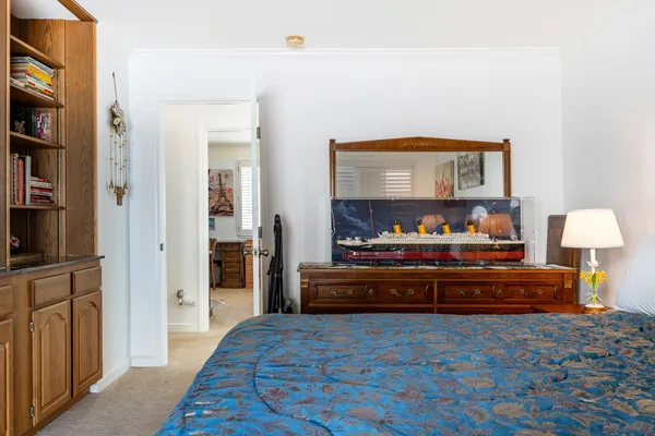 a bedroom with a bed and a television in it