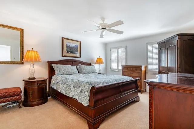 a bed room with furniture and a lamp