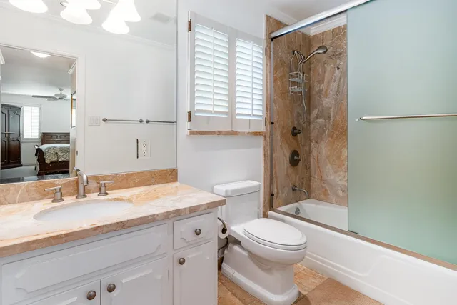 a backyard of a house with wooden fence