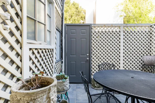 a view of a balcony table and chairs