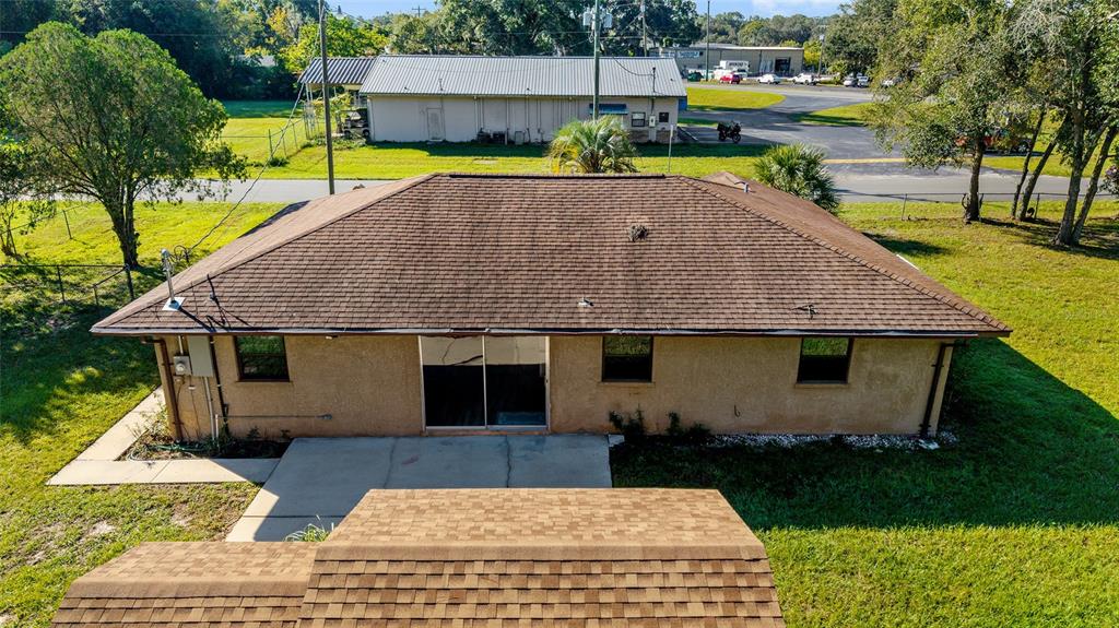5201 East Jasmine Lane Inverness, FL 34453 - Photo 14 of 50 a aerial view of a house with swimming pool lawn chairs and a yard