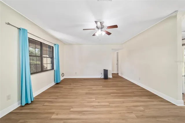 a view of an empty room with a window