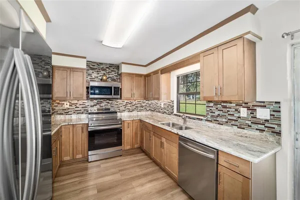 a kitchen with a sink and a window
