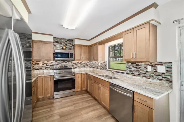 a kitchen with a sink and a window