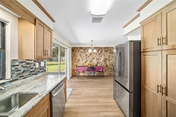 a bedroom with furniture and a large window