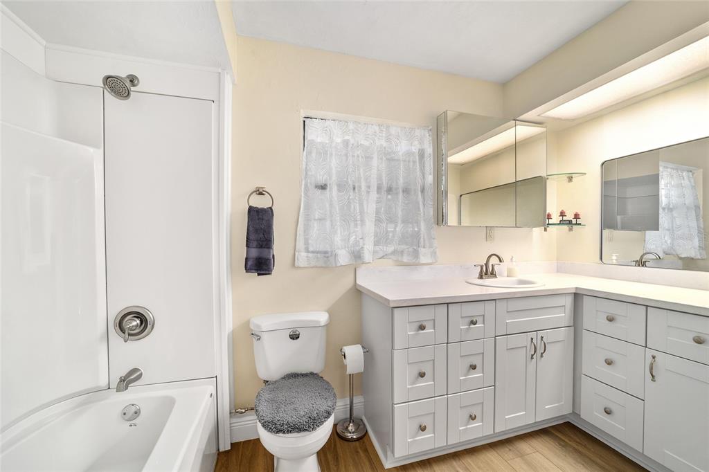 5201 East Jasmine Lane Inverness, FL 34453 - Photo 34 of 50 a spacious bathroom with a tub sink and mirror