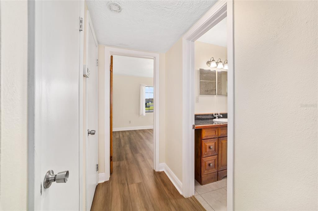 5201 East Jasmine Lane Inverness, FL 34453 - Photo 37 of 50 a view of hallway with wooden floor