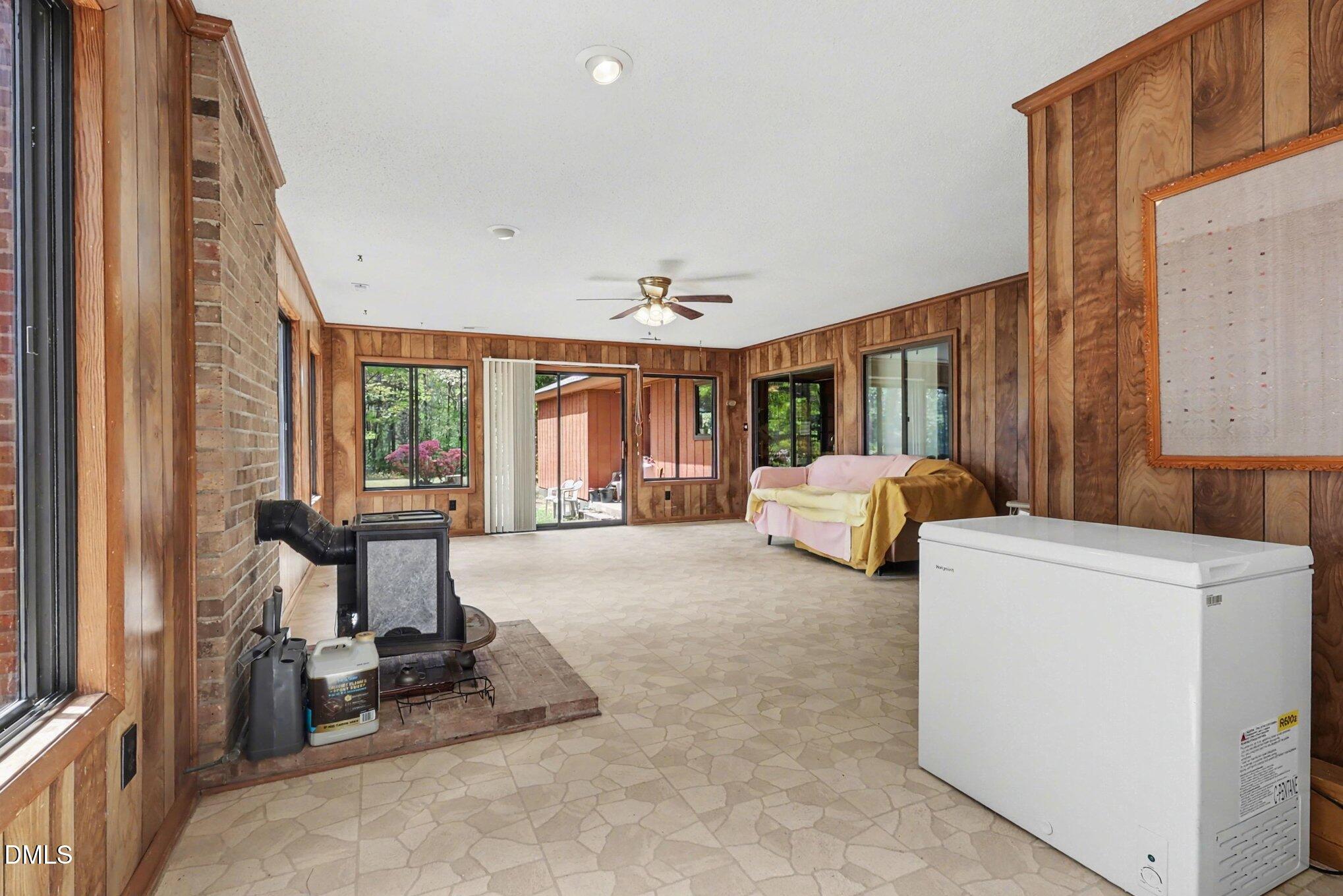 5702 Old Greensboro Road Chapel Hill, NC 27516 - Photo 11 of 43 a room with furniture and a large window