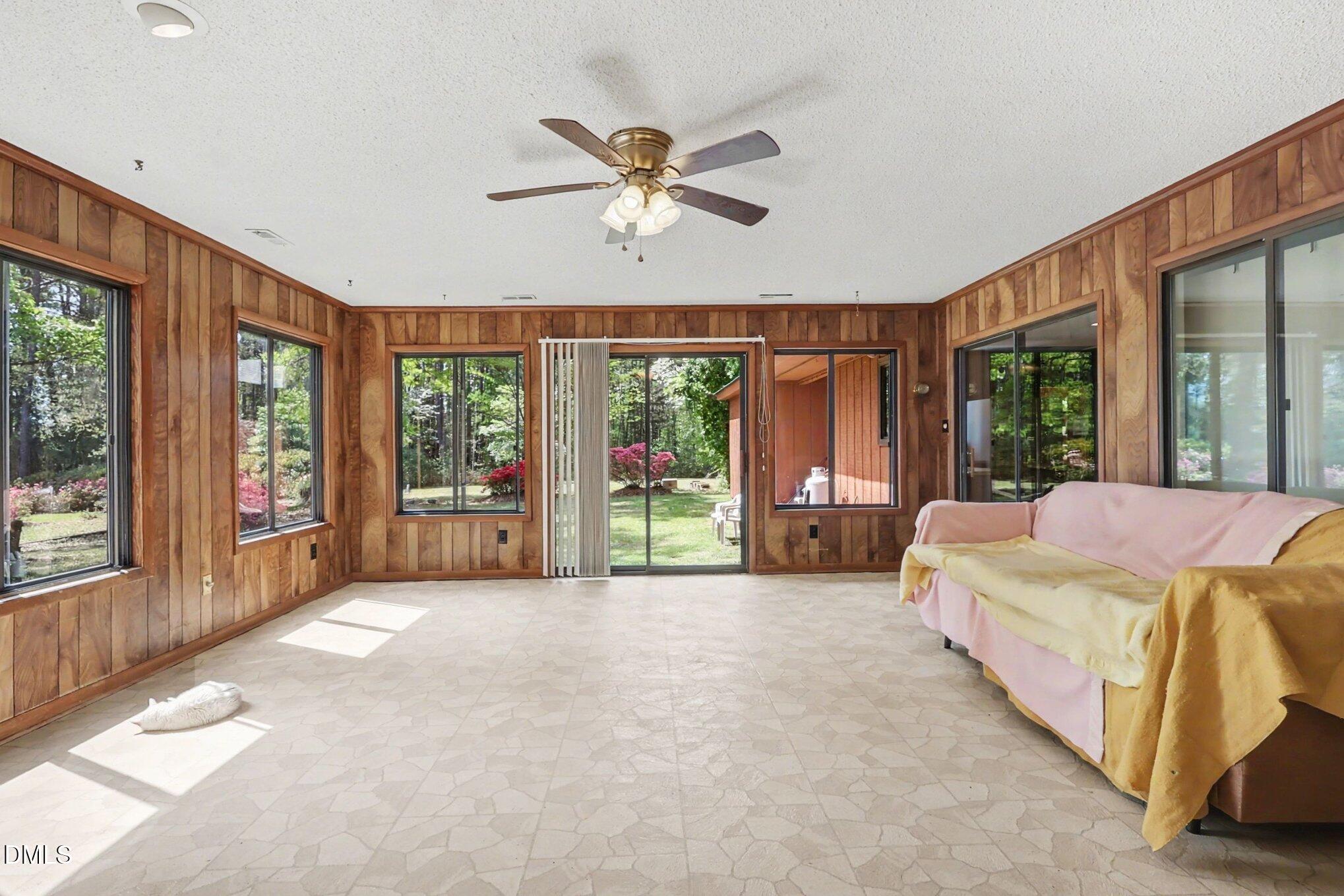 5702 Old Greensboro Road Chapel Hill, NC 27516 - Photo 12 of 43 a bed sitting in a spacious bedroom next to a large window