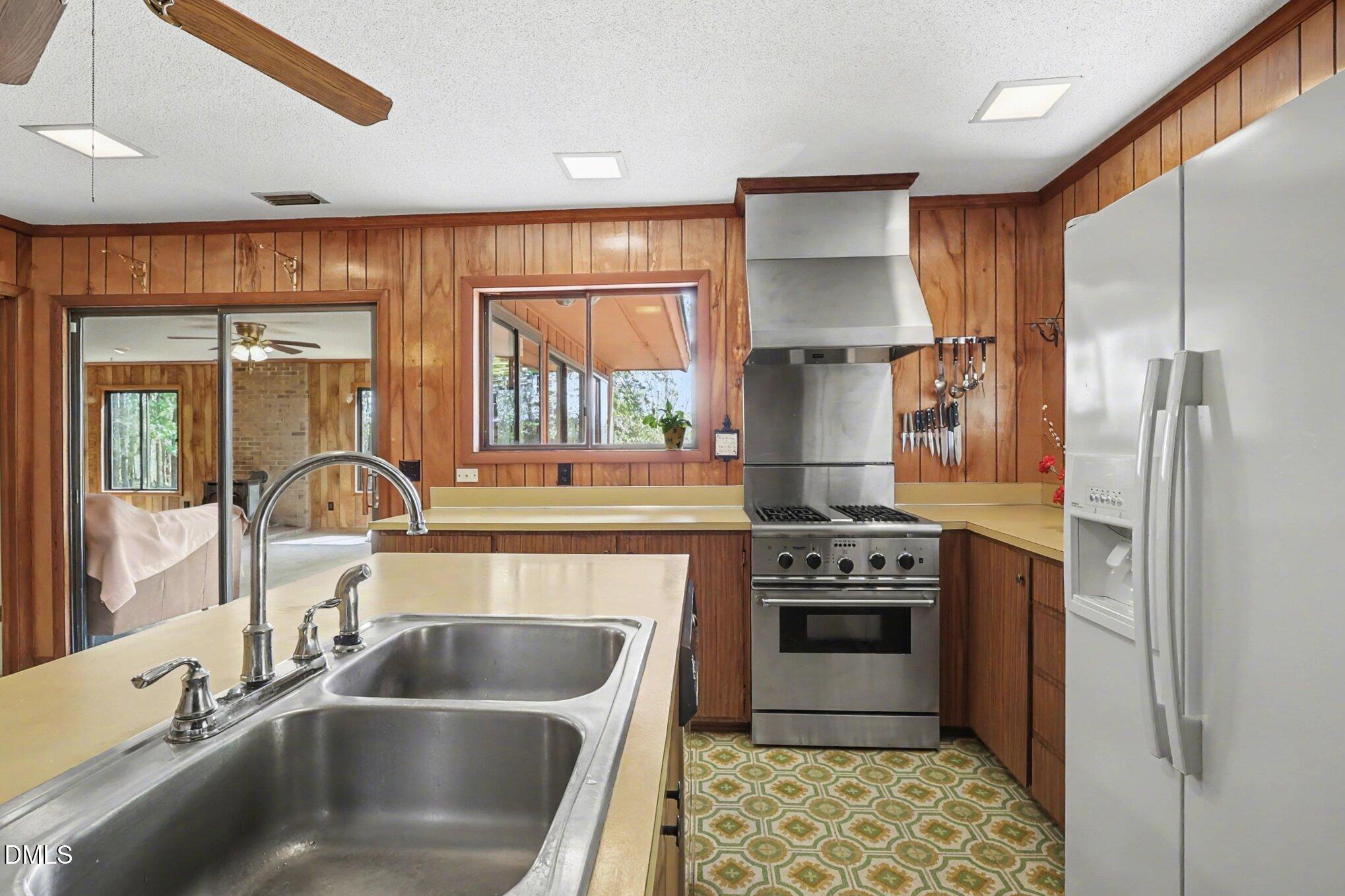 5702 Old Greensboro Road Chapel Hill, NC 27516 - Photo 17 of 43 a kitchen with a sink cabinets and stainless steel appliances