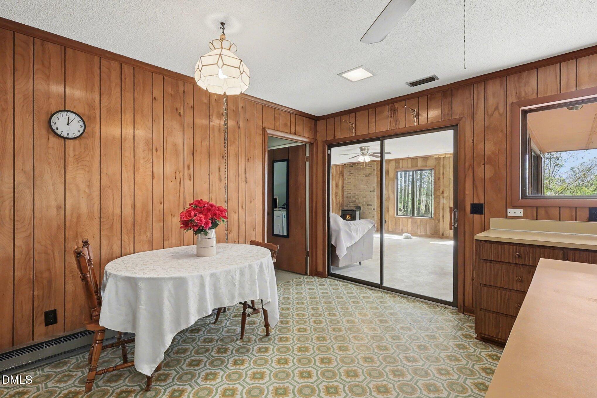 5702 Old Greensboro Road Chapel Hill, NC 27516 - Photo 18 of 43 a dining room with furniture and window