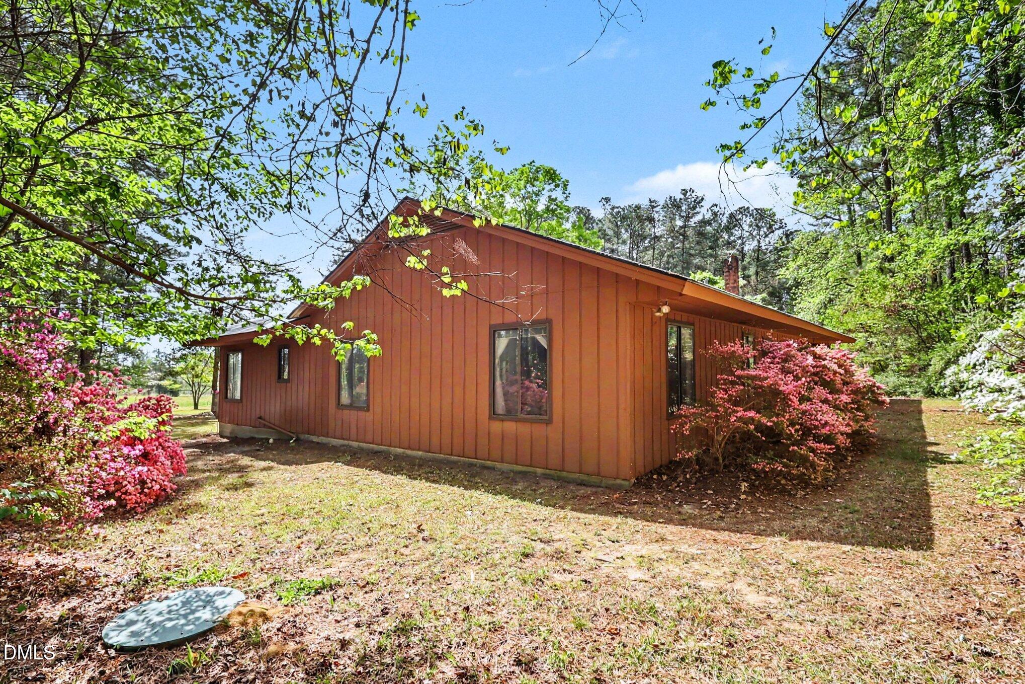 5702 Old Greensboro Road Chapel Hill, NC 27516 - Photo 2 of 43 a front view of a house with a yard