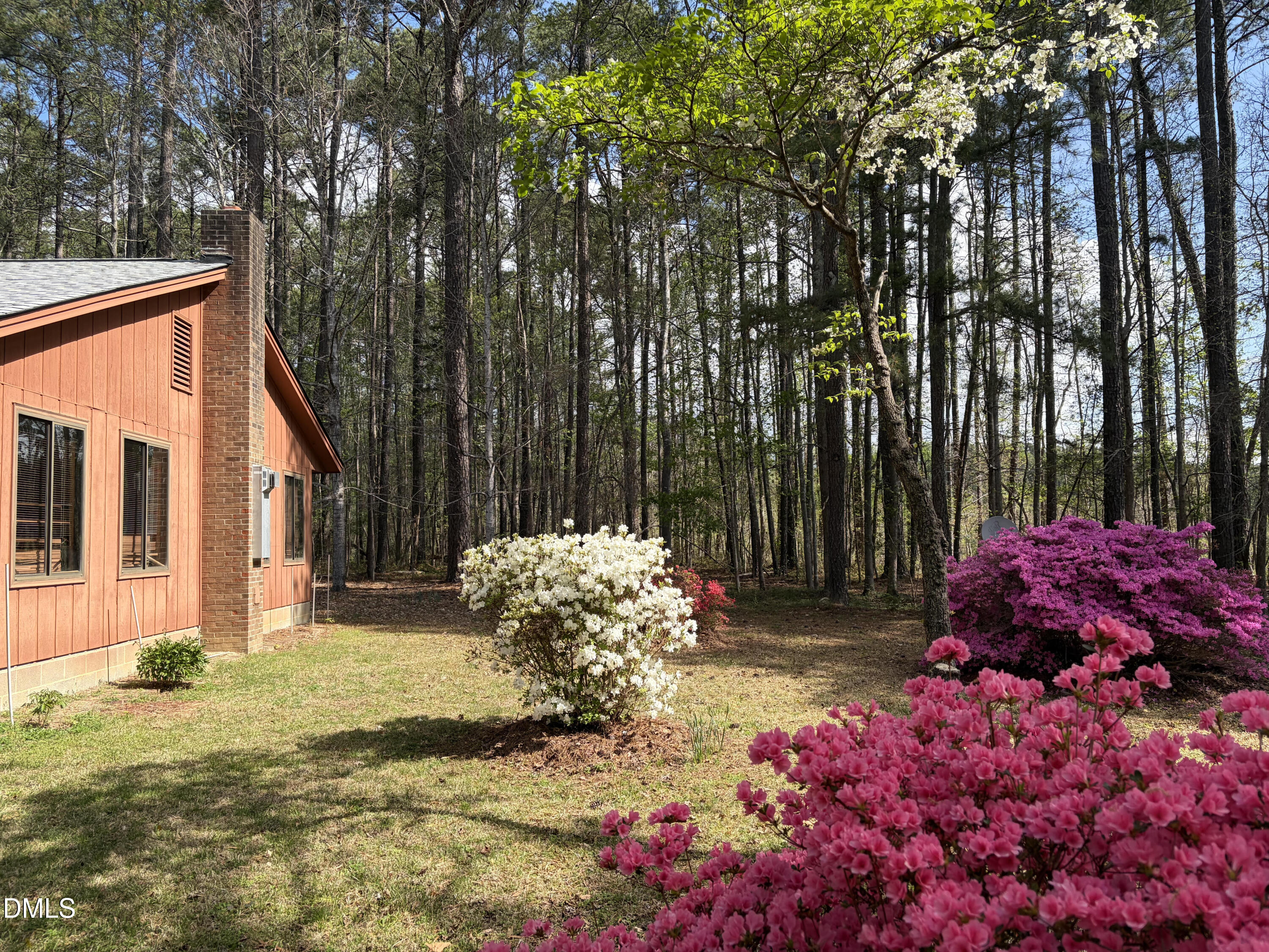 5702 Old Greensboro Road Chapel Hill, NC 27516 - Photo 29 of 43 a view of a backyard with flowers