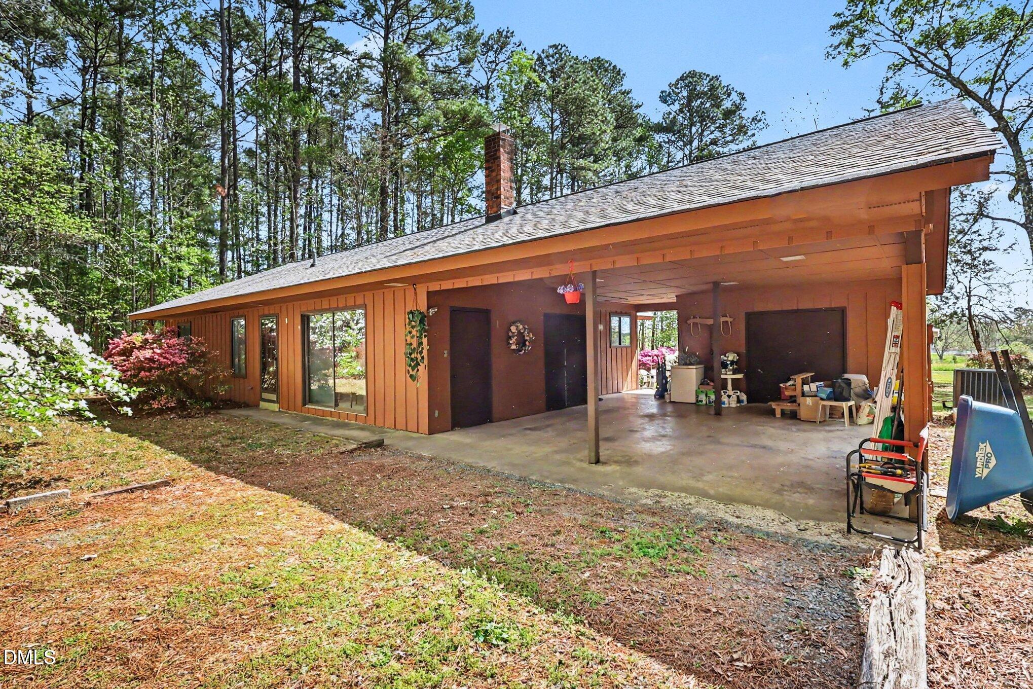 5702 Old Greensboro Road Chapel Hill, NC 27516 - Photo 3 of 43 a view of a house with a patio