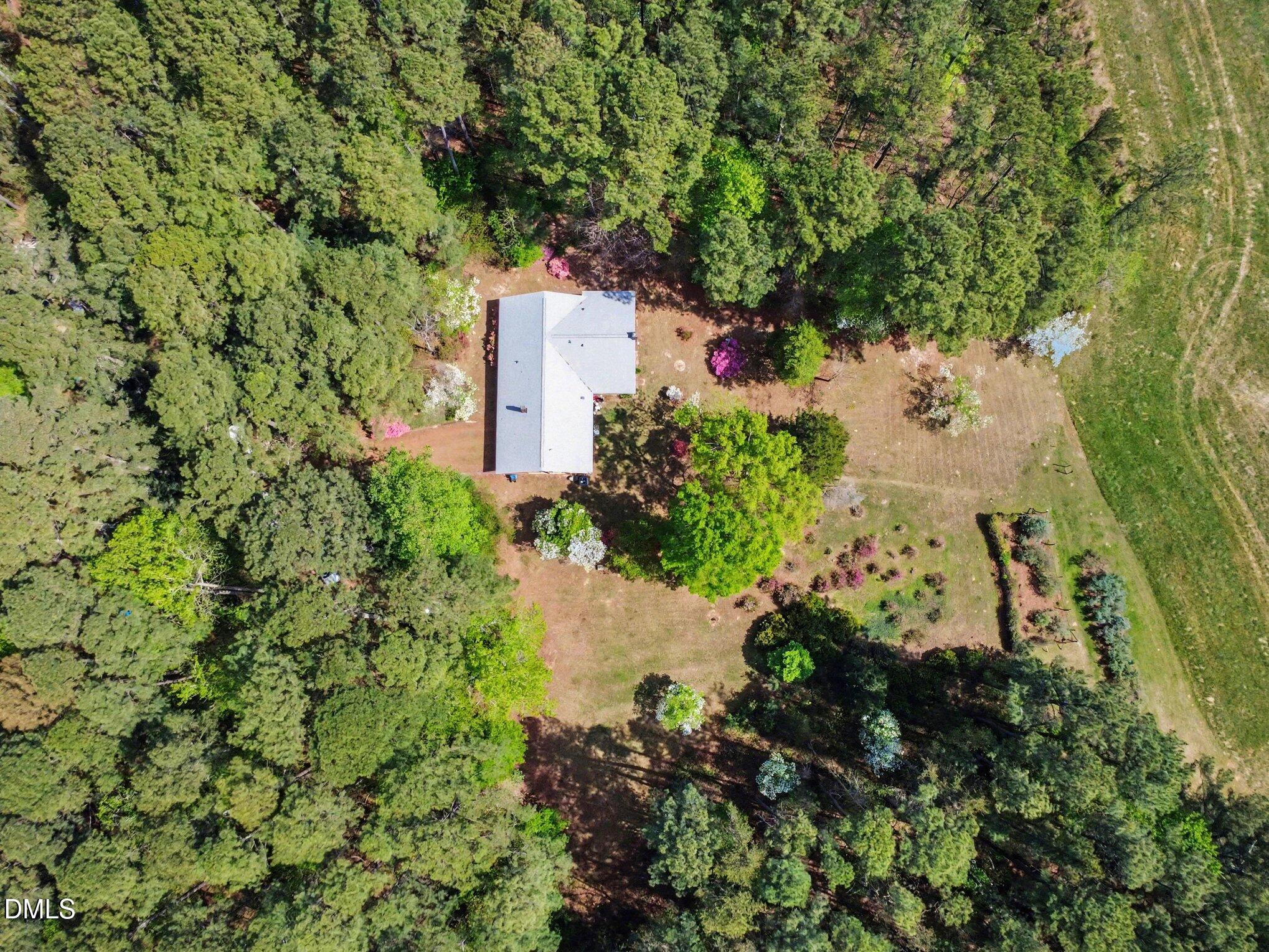 5702 Old Greensboro Road Chapel Hill, NC 27516 - Photo 34 of 43 a backyard of a house with a yard and outdoor seating