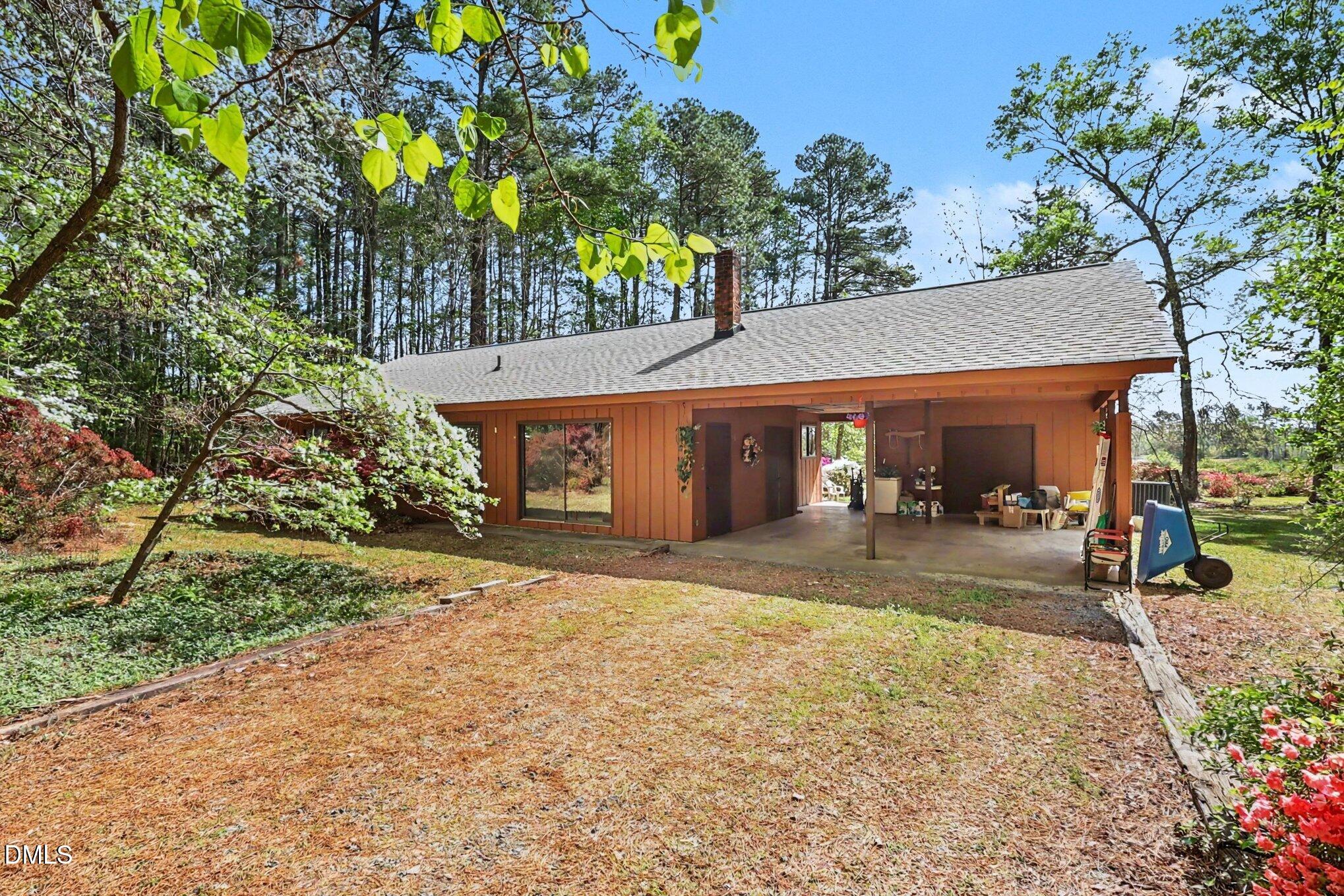 5702 Old Greensboro Road Chapel Hill, NC 27516 - Photo 4 of 43 a view of a house with yard and tree s