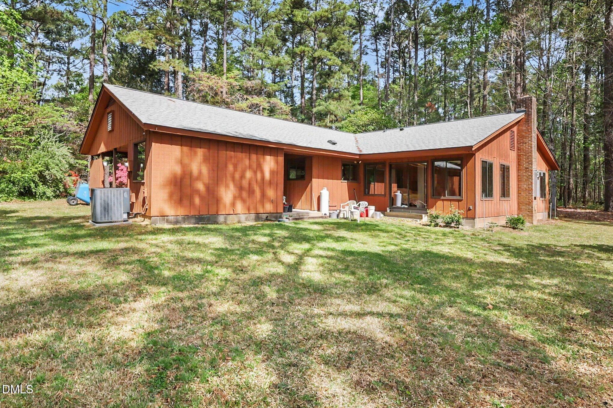 5702 Old Greensboro Road Chapel Hill, NC 27516 - Photo 6 of 43 a front view of house with yard outdoor seating and green space