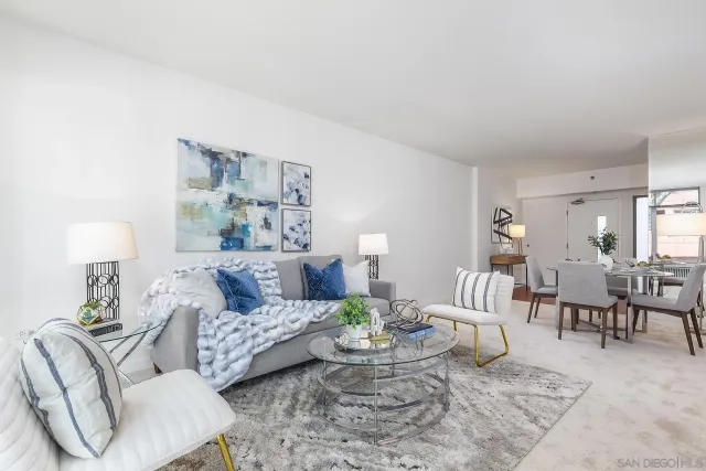 a living room with furniture and a lamp