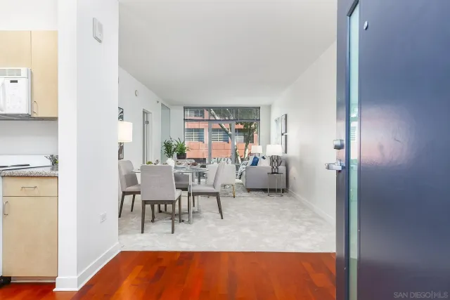 a bedroom with furniture and wooden floor
