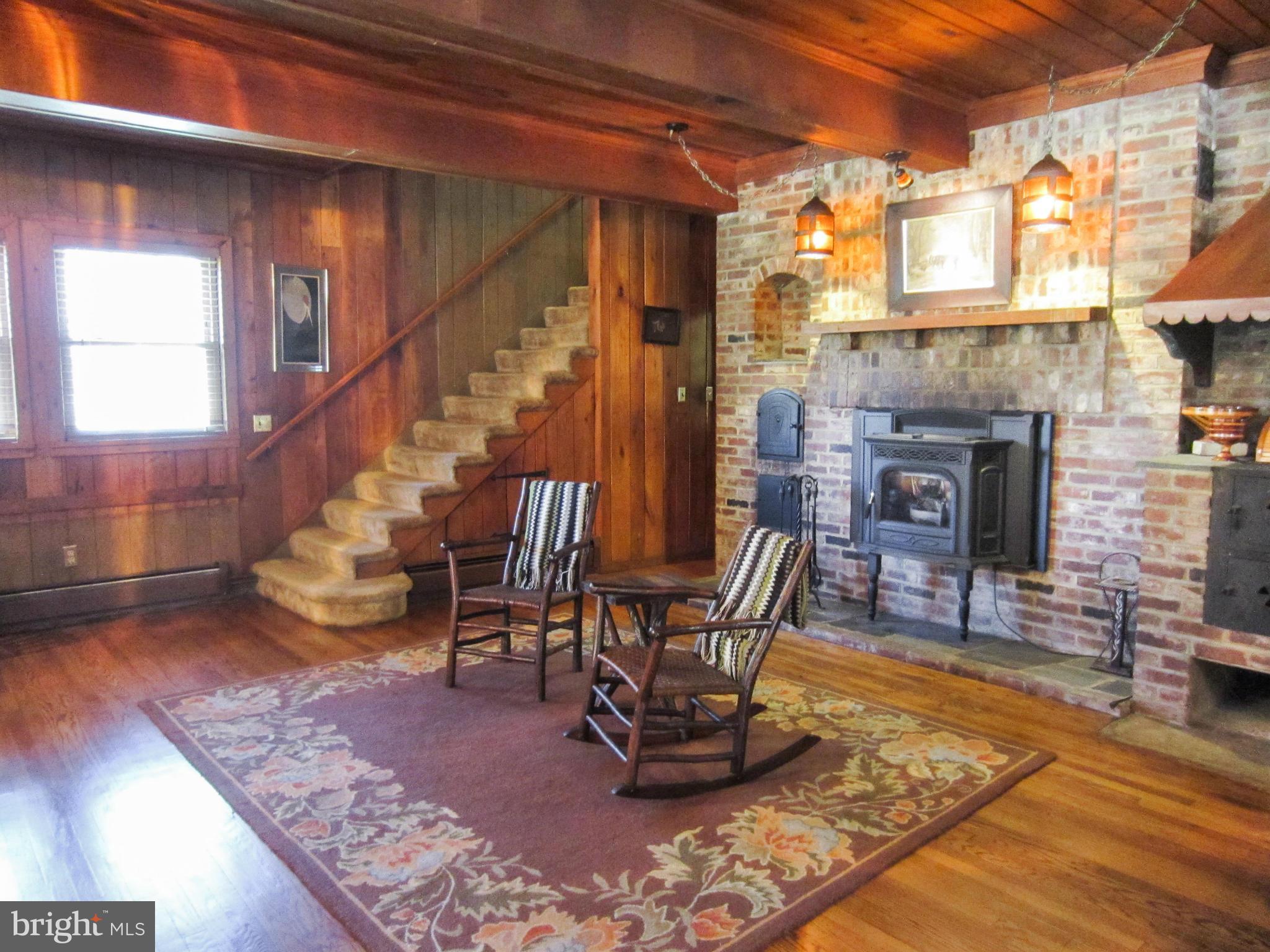 6042 Drum Point Road Deale, MD 20751 - Photo 11 of 21 a living room with furniture and a fireplace