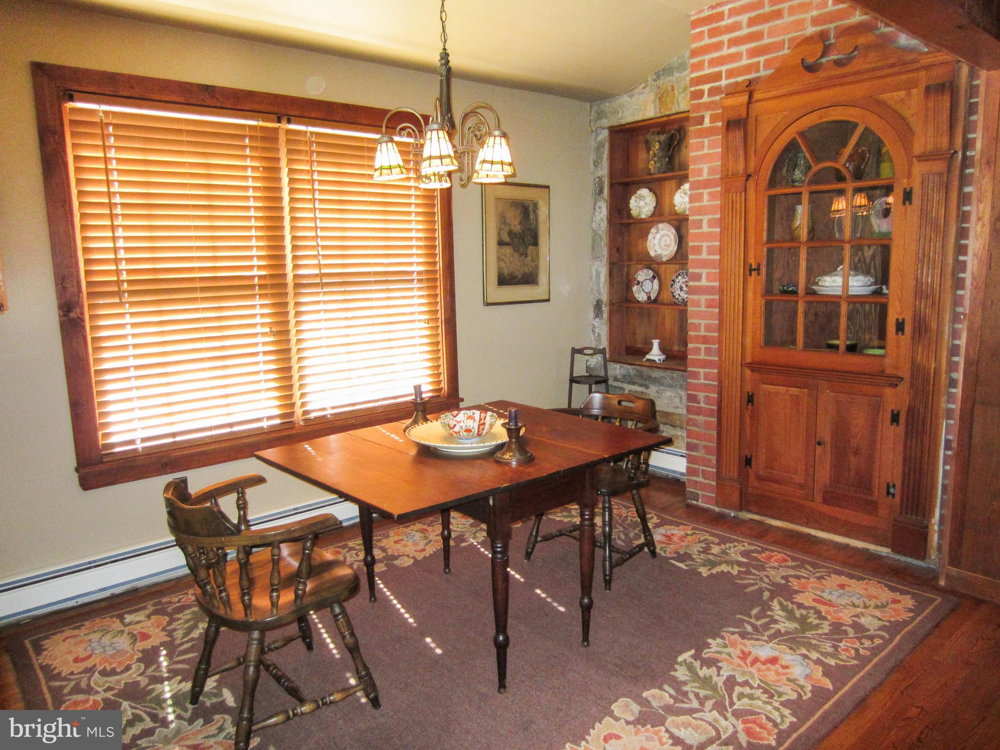 6042 Drum Point Road Deale, MD 20751 - Photo 13 of 21 a view of a dining room with furniture and chandelier