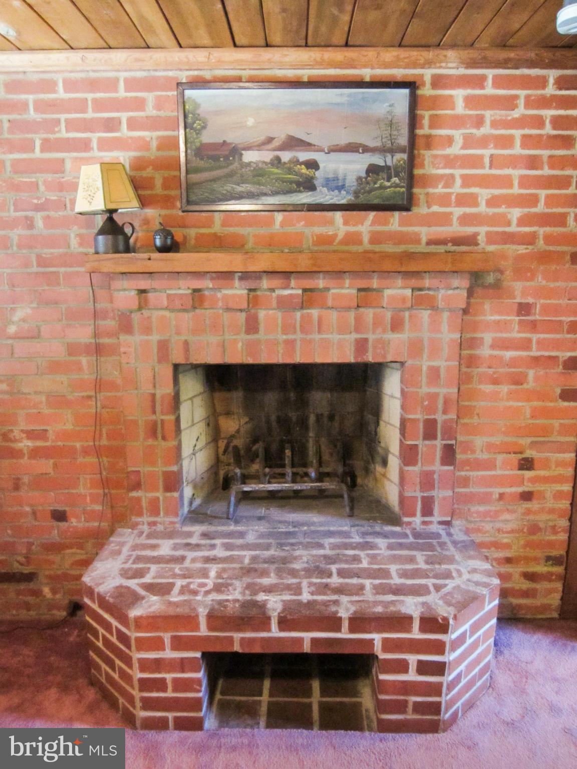6042 Drum Point Road Deale, MD 20751 - Photo 16 of 21 a room with fireplace