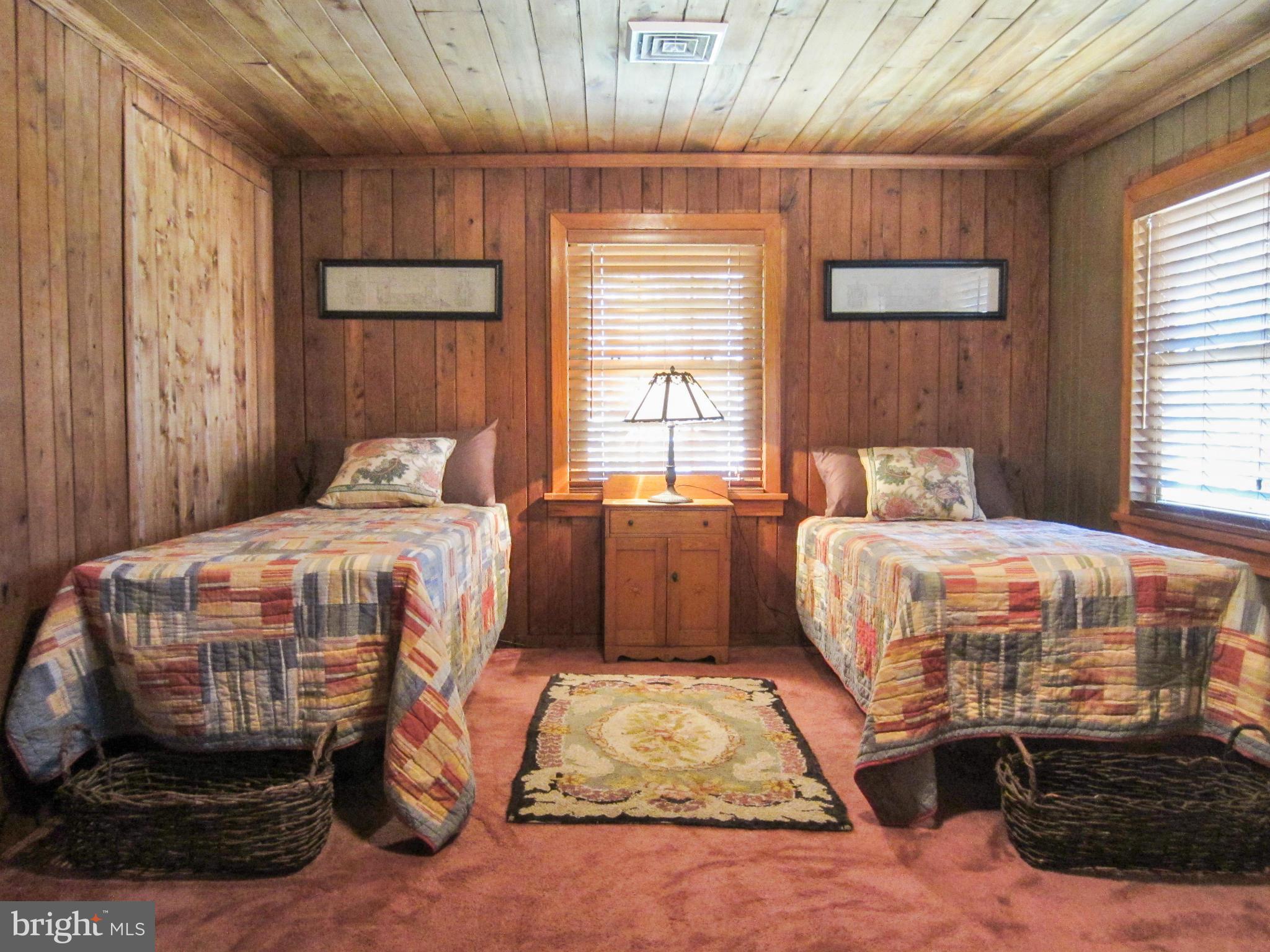 6042 Drum Point Road Deale, MD 20751 - Photo 17 of 21 a bedroom with a bed and a dresser