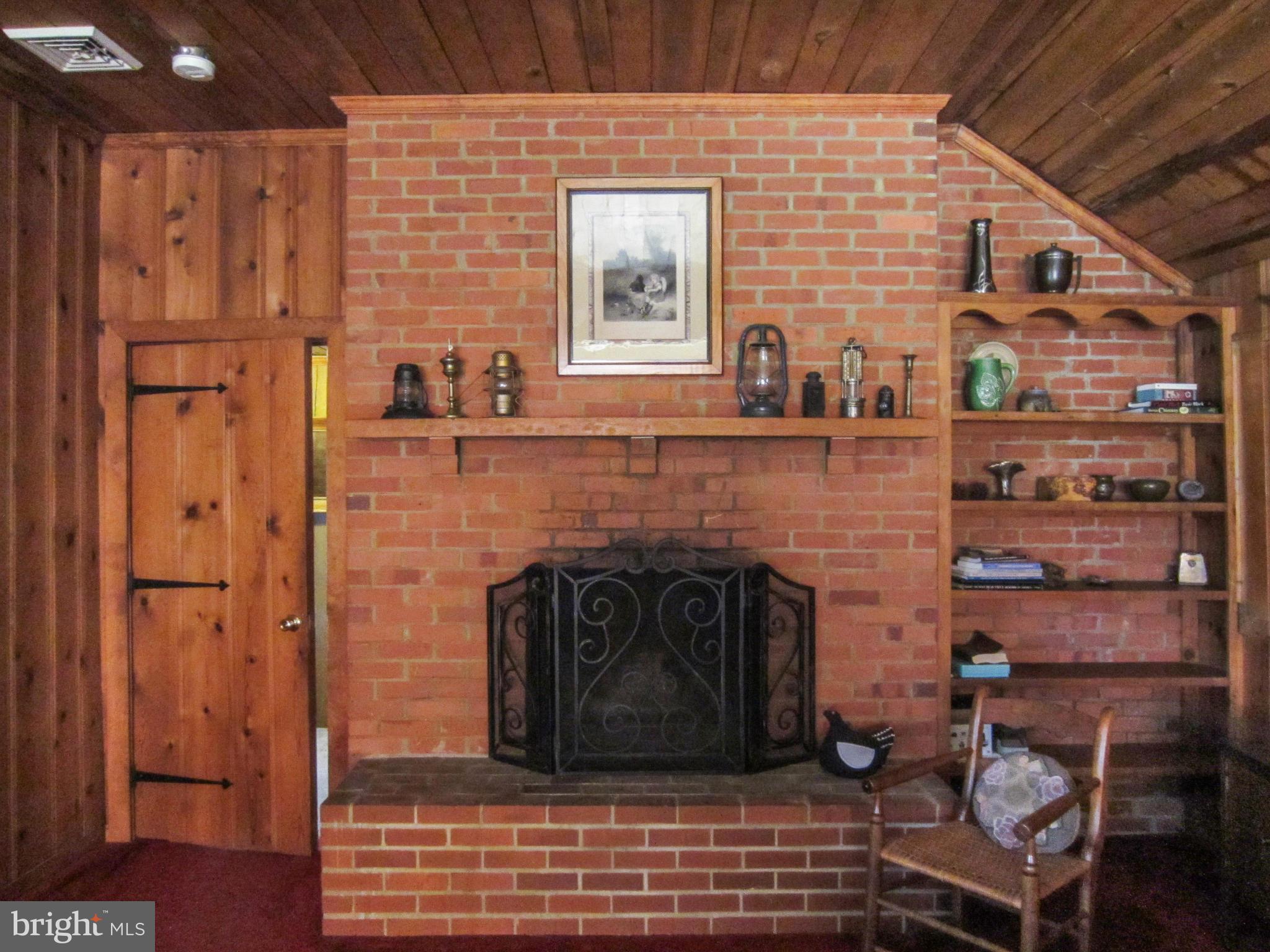 6042 Drum Point Road Deale, MD 20751 - Photo 18 of 21 a view of a livingroom with furniture and a fireplace