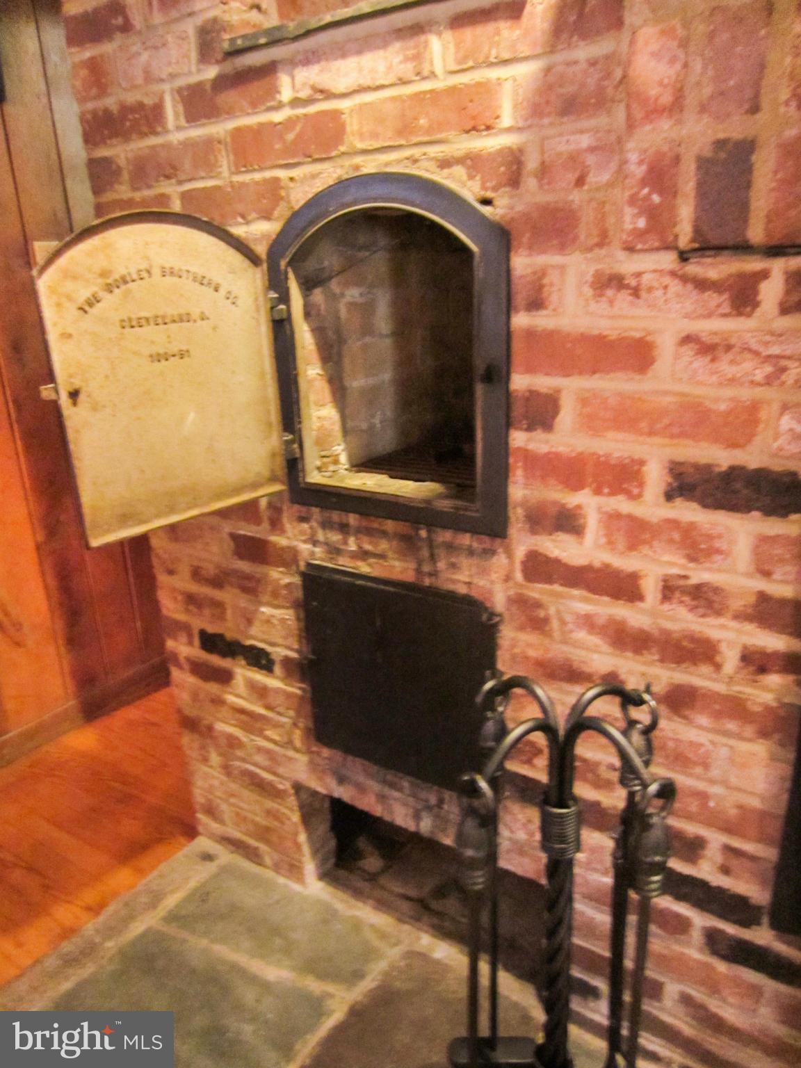 6042 Drum Point Road Deale, MD 20751 - Photo 21 of 21 a living room with a stove and a fireplace