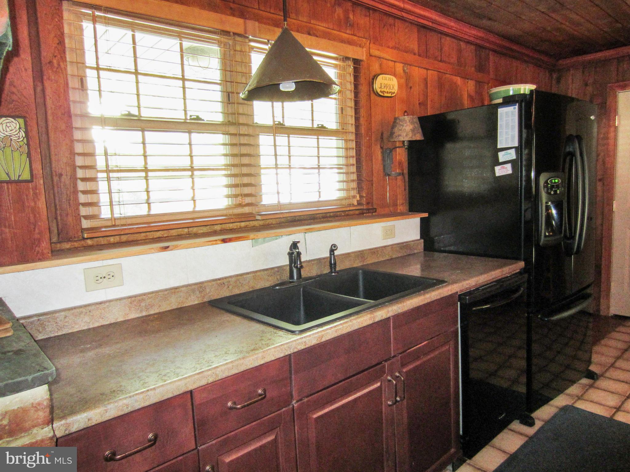 6042 Drum Point Road Deale, MD 20751 - Photo 7 of 21 a kitchen with a sink and large window