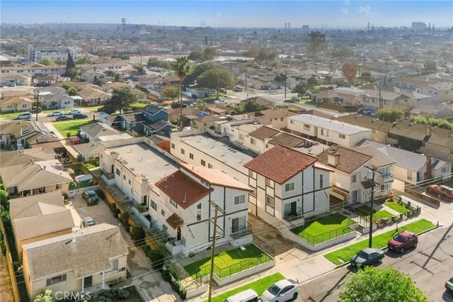 an aerial view of a house with a mountain