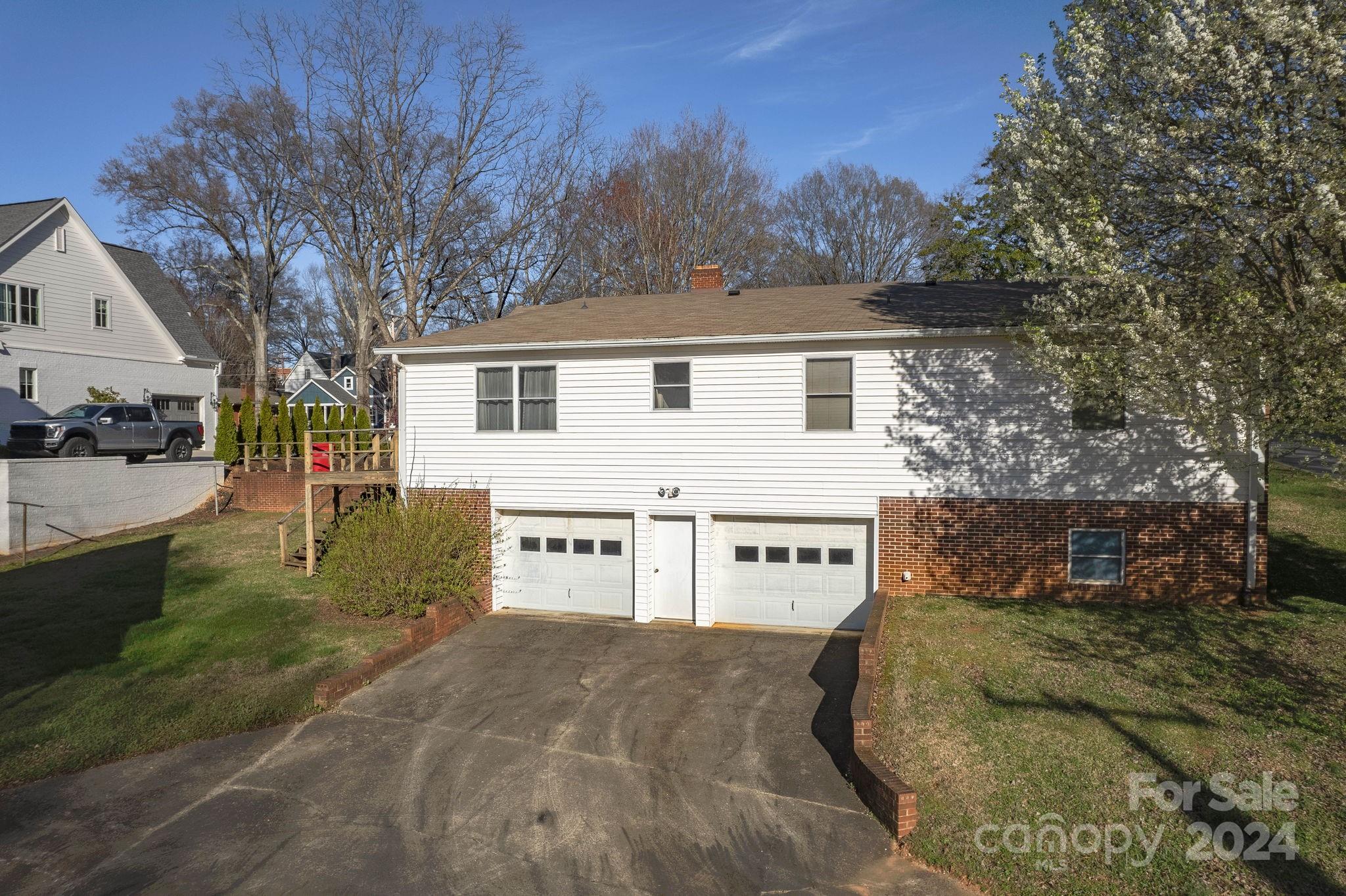 318 Walnut Street Davidson, NC 28036 - Photo 15 of 21 a view of a house with a yard covered in snow