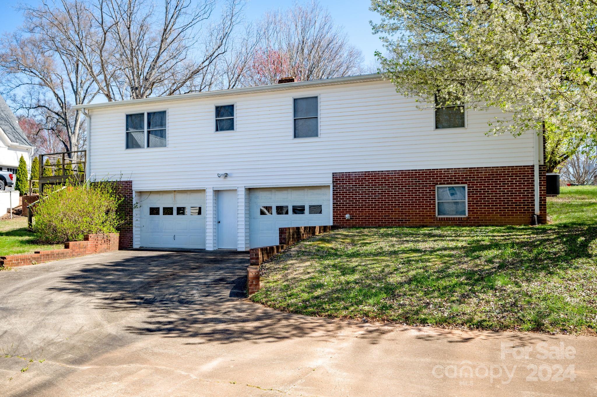 318 Walnut Street Davidson, NC 28036 - Photo 20 of 21 a view of a house with a yard and a large tree