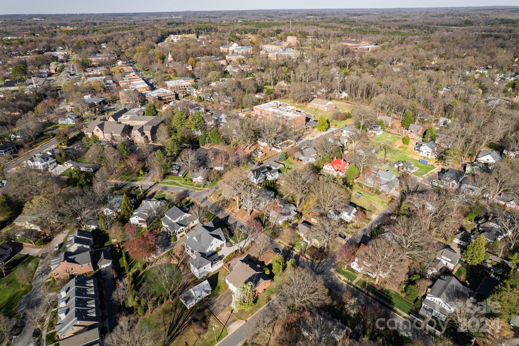 318 Walnut Street Davidson, NC 28036 - Photo 9 of 21 an aerial view of house with yard and mountain view in back
