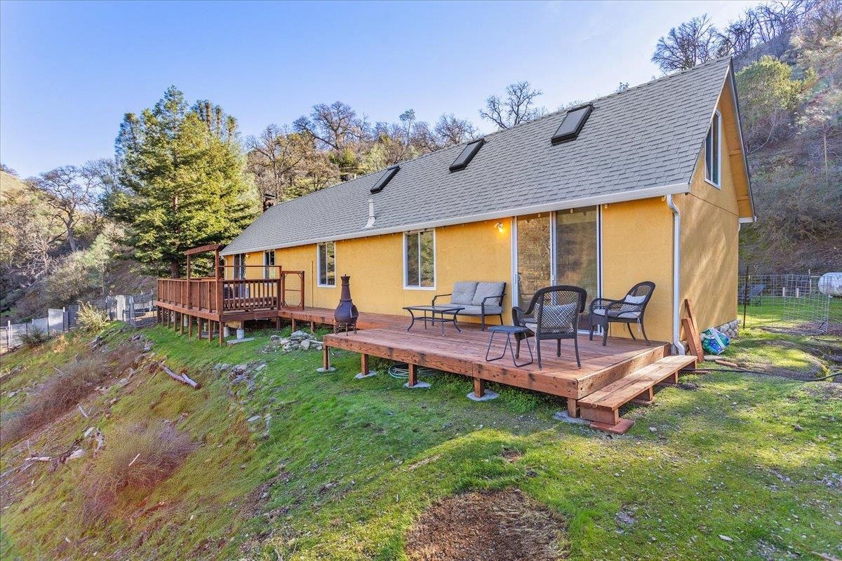 17370 West Corral Hollow Road Tracy, CA 95377 - Photo 22 of 43 a view of a patio with table and chairs potted plants and a large tree