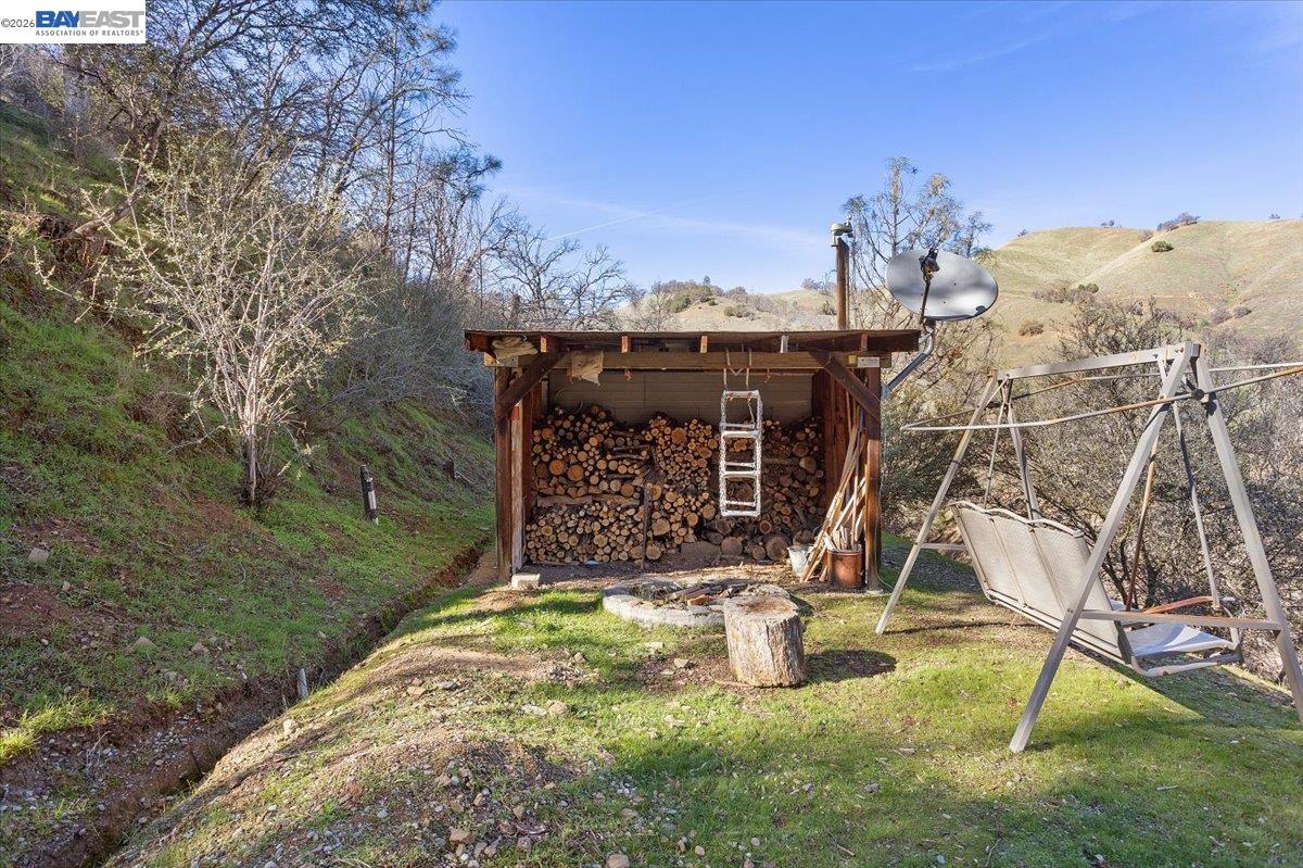 17370 West Corral Hollow Road Tracy, CA 95377 - Photo 28 of 43 a view of a backyard with a table and chairs