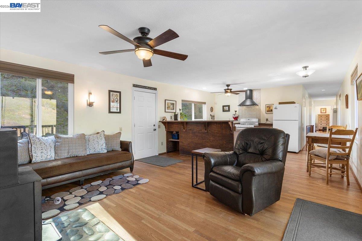 17370 West Corral Hollow Road Tracy, CA 95377 - Photo 3 of 43 a living room with furniture and a wooden floor