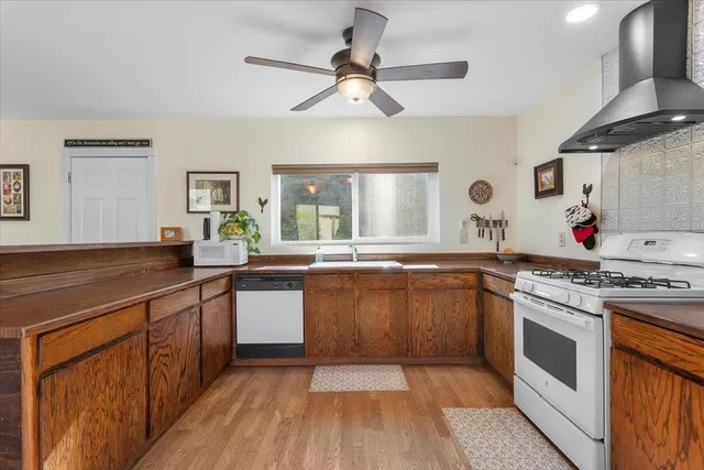 a bedroom with a bed and a chair