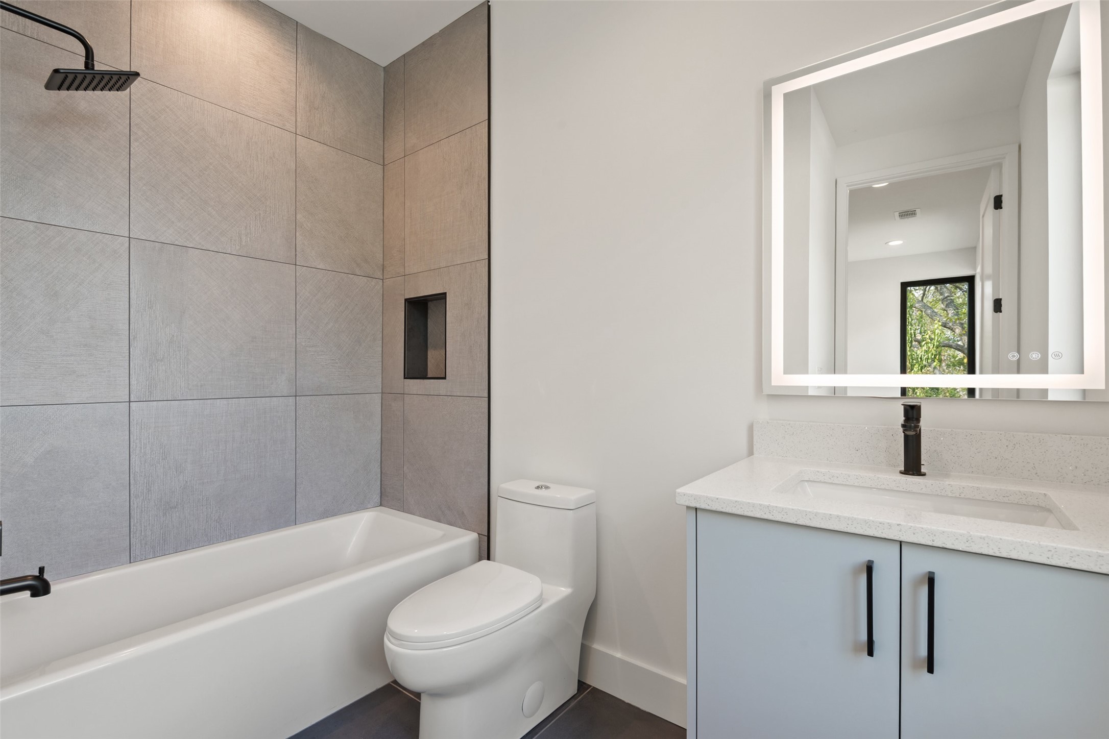 4407 Merle Drive, Unit B Austin, TX 78745 - Photo 29 of 38 a bathroom with a granite countertop sink toilet and shower