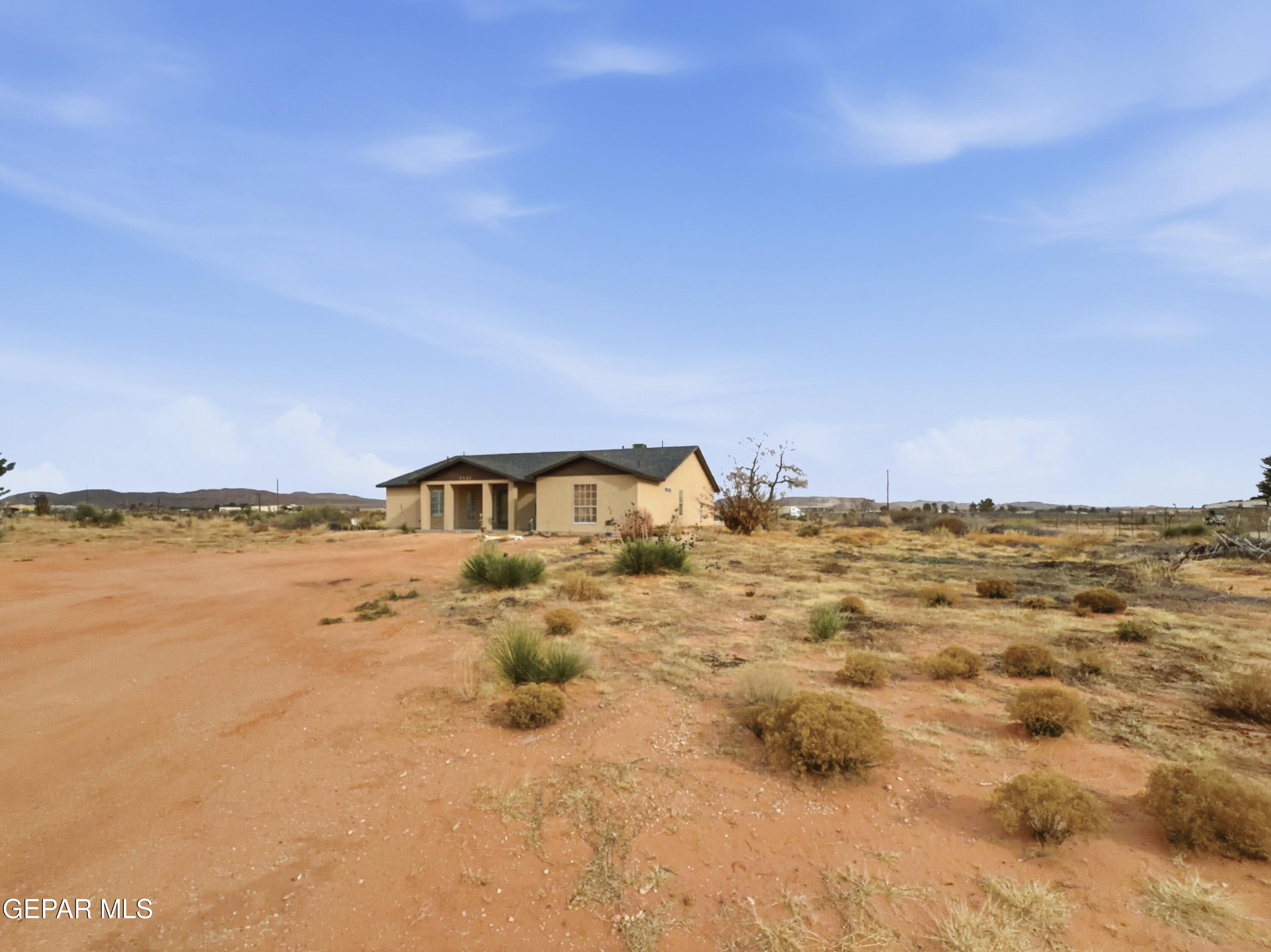 5156 Bradley Road El Paso, TX 79938 - Photo 1 of 39 a view of a ocean with a mountain in the background