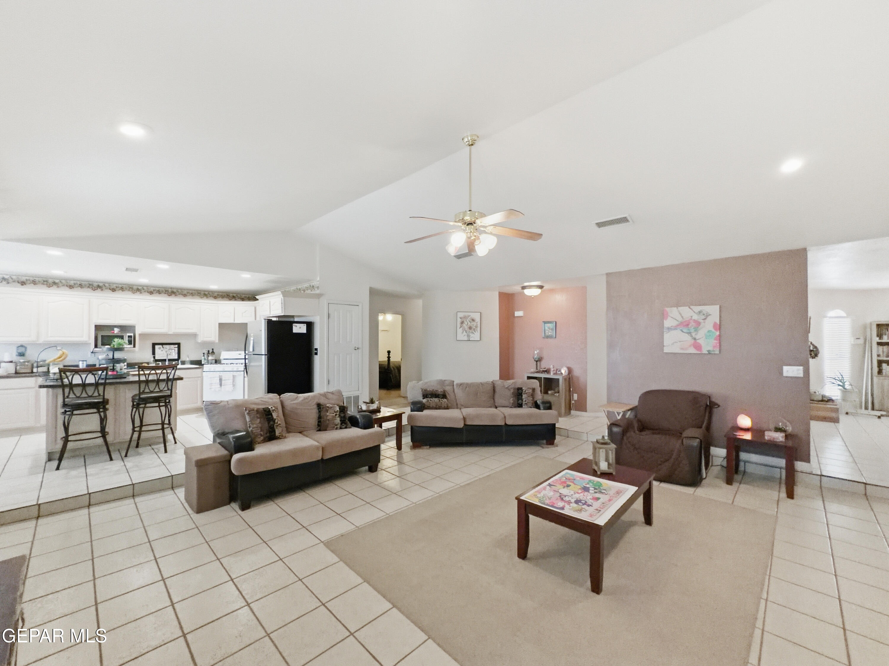 5156 Bradley Road El Paso, TX 79938 - Photo 11 of 39 a living room with furniture and a chandelier