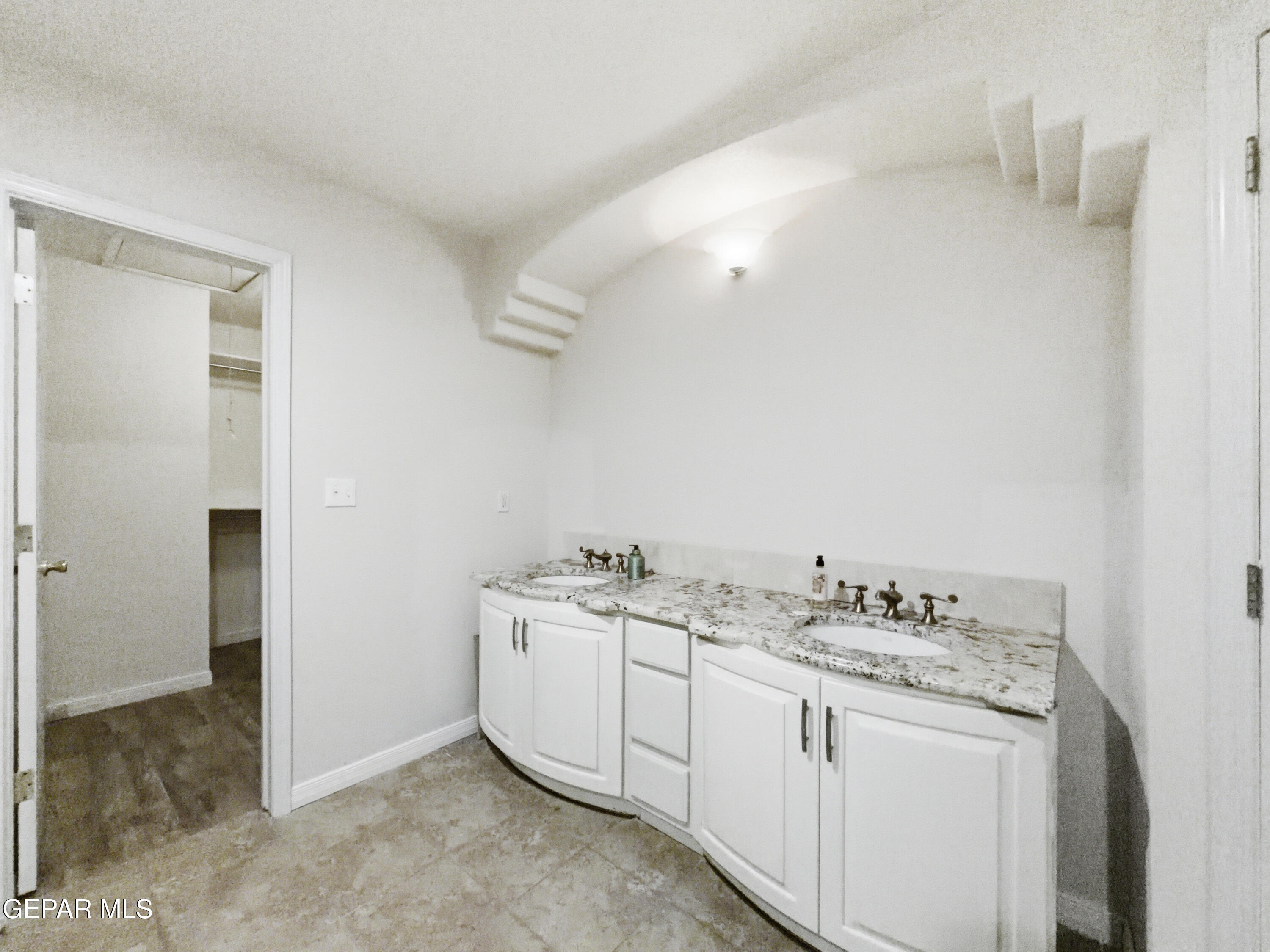 5156 Bradley Road El Paso, TX 79938 - Photo 28 of 39 a bathroom with a sink and a mirror