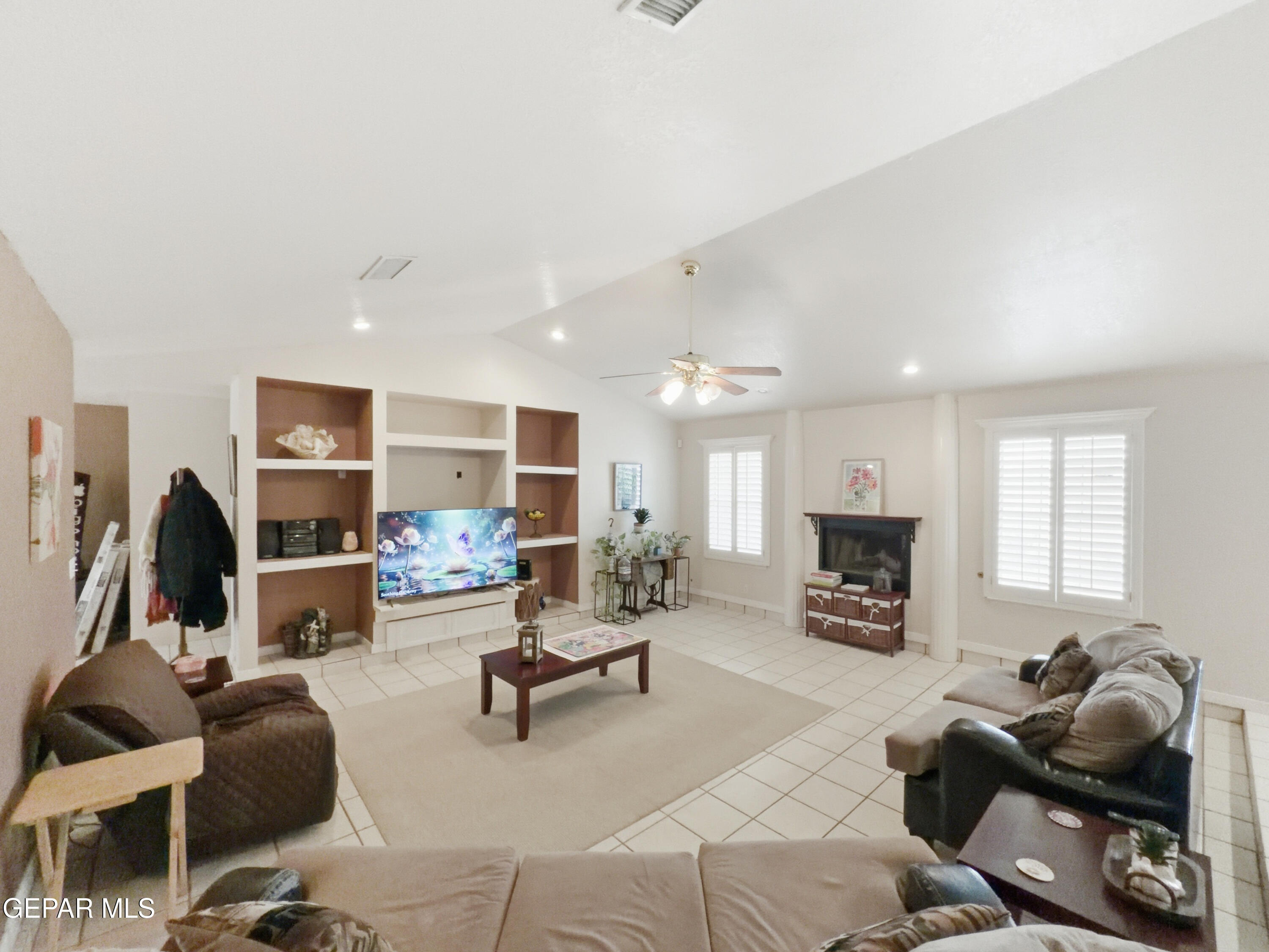 5156 Bradley Road El Paso, TX 79938 - Photo 8 of 39 a living room with furniture fireplace and a window