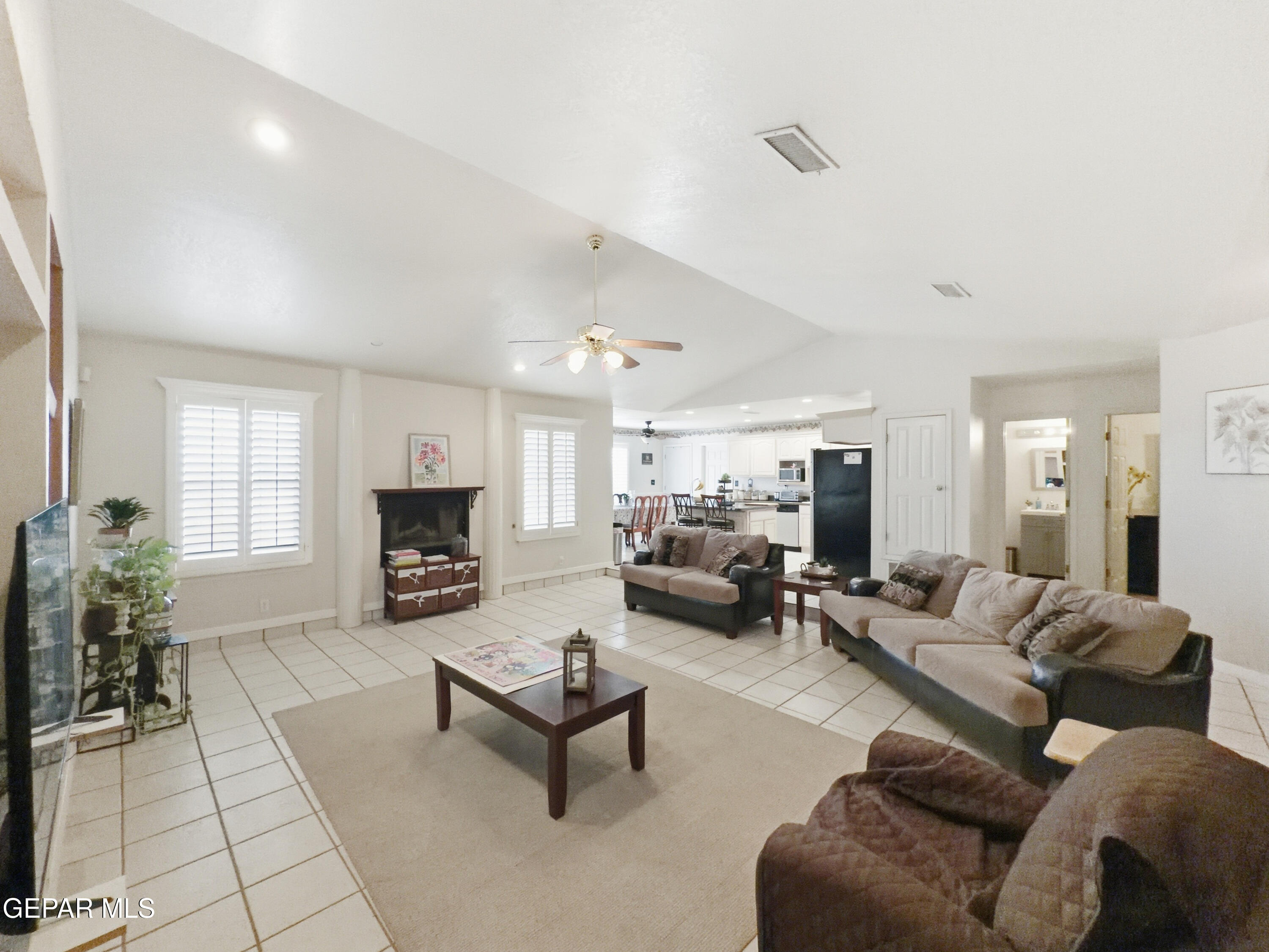 5156 Bradley Road El Paso, TX 79938 - Photo 10 of 39 a living room with furniture and a fireplace