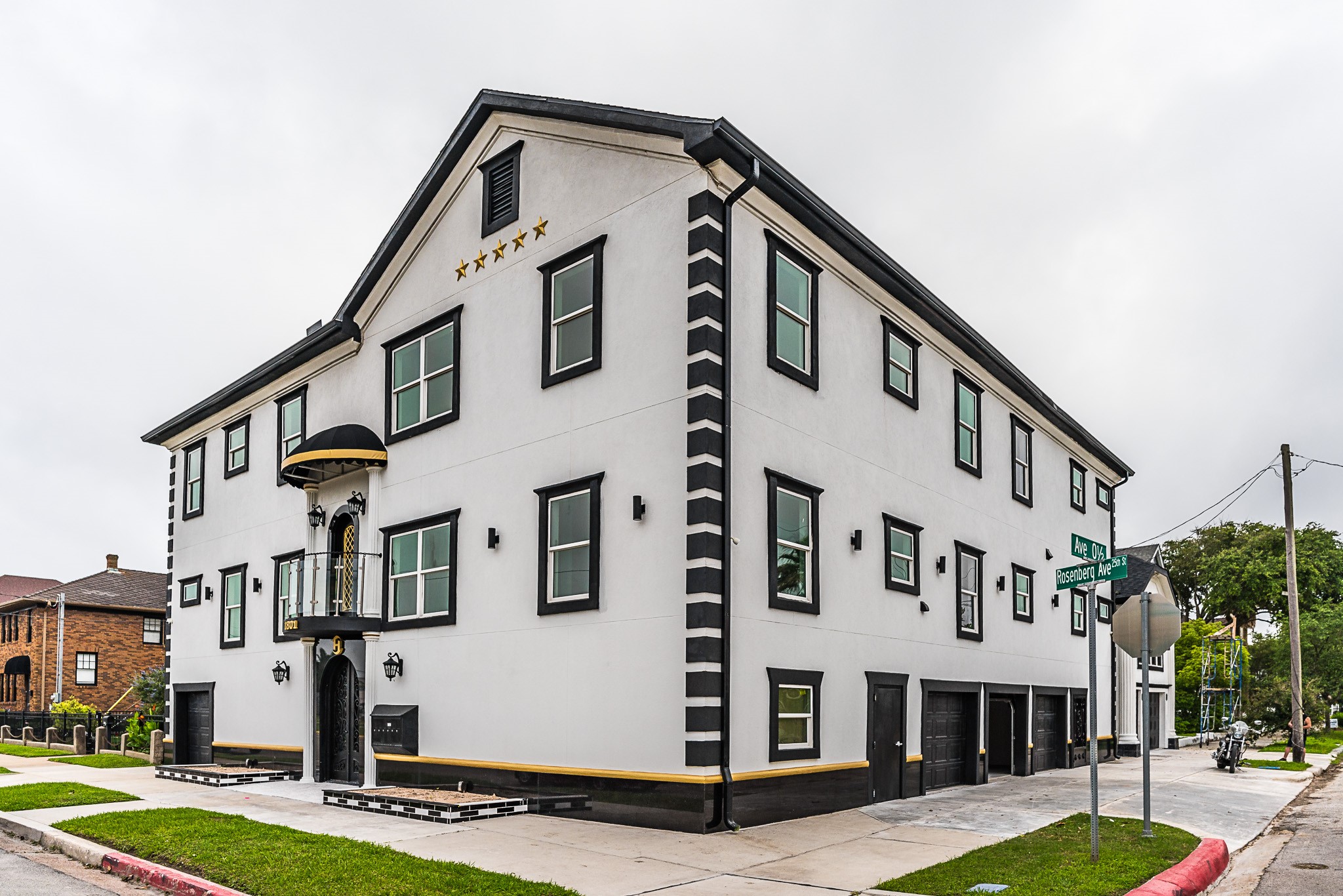 1801 Rosenberg Street, Unit 204 Galveston, TX 77550 - Photo 1 of 27 a front view of building with yard