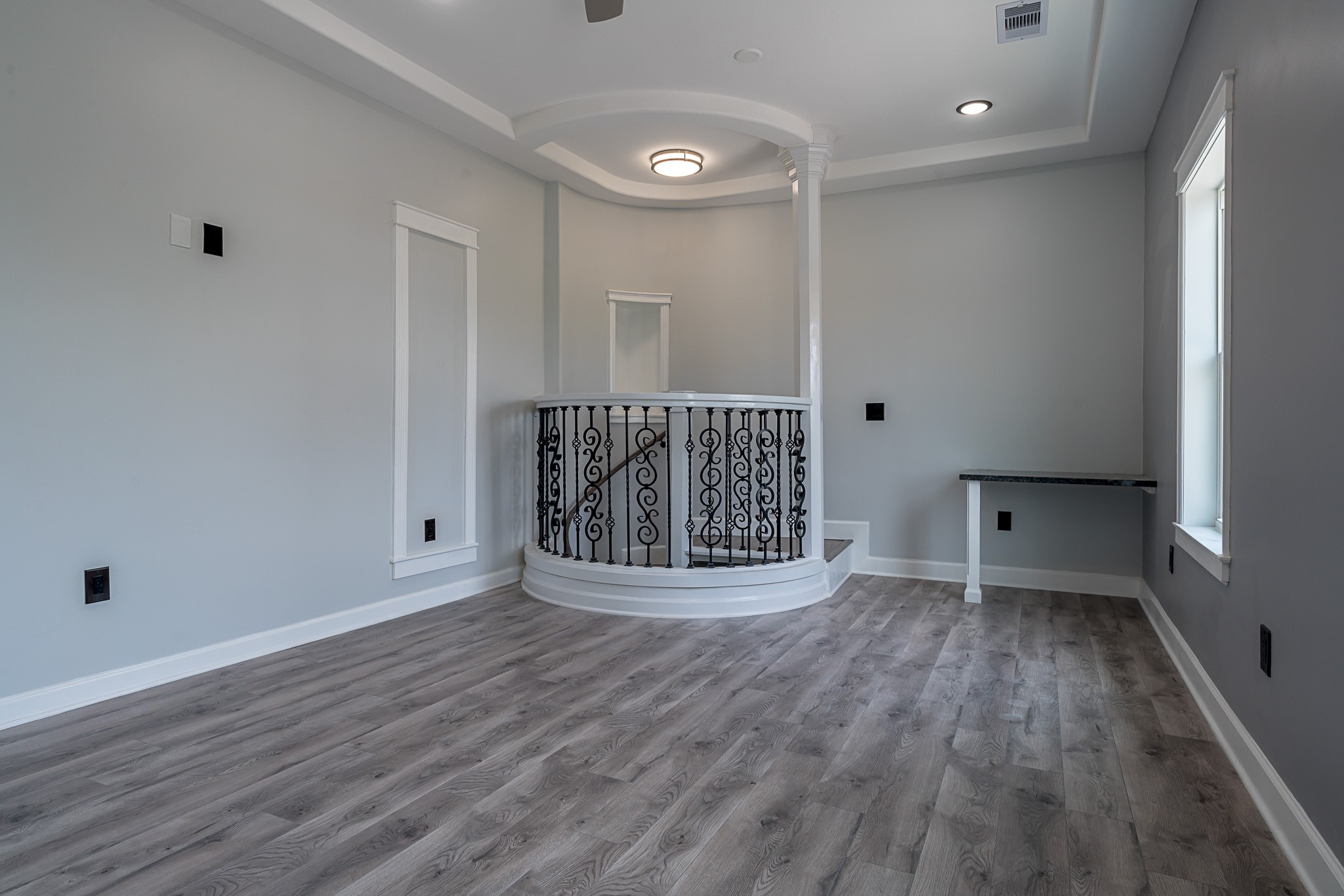 1801 Rosenberg Street, Unit 204 Galveston, TX 77550 - Photo 21 of 27 a view of wooden floor and brick walls